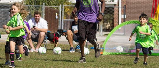 Image of Kids Running at a Tampa Special Needs Soccer Program Class